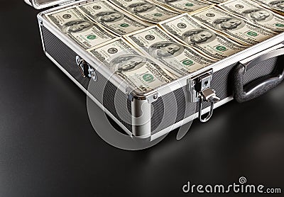 Case full of money on gray background Stock Photo