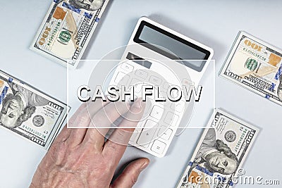 Cash flow concept. Cashflow word on photo with dollars and calculator Stock Photo