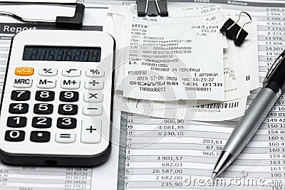 Cash registers purchase receipt written on russian language, calculator and financial reports, analysis and accounting, various Stock Photo