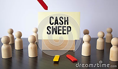 Cash sweep lettering on craft paper, money in the background. Stock Photo