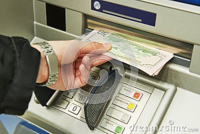 Dollar cash withdrawal from ATM Stock Photo