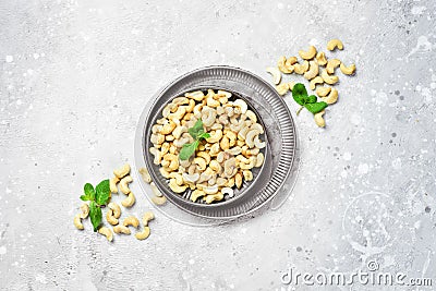 Cashew nut on a stone background. Roasted nuts. Assortment of nuts. Stock Photo