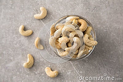 Cashew nuts in the glass bowl on stone table Stock Photo