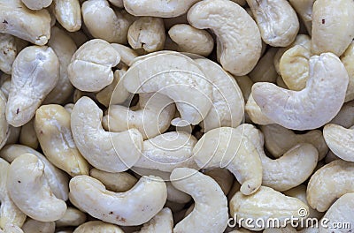 Cashew pile closeup. Cashew macro photo background. Organic food rustic banner template. Stock Photo