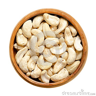 Cashew nuts, raw cashews, seeds of shelled fruits, in a wooden bowl Stock Photo