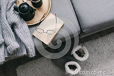 Sweater and reading on sofa Stock Photo