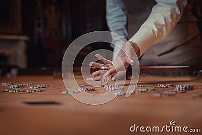 American roulette table, the dealer puts Dolly on the winning number Stock Photo