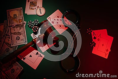 Casino, blackjack and poker theme with cards, handcuffs, wooden gavel and chips, top view Stock Photo