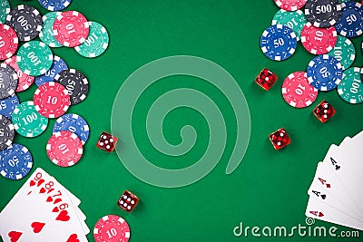 Casino games related items on green table, copy space Stock Photo