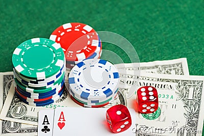 Casino green table with chips, money and dices Stock Photo