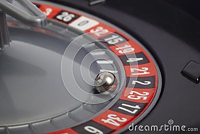 Casino roulette detail with ball in number twenty-five. Gambling Stock Photo