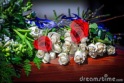 Flowers On A Casket With Red And White Roses Stock Photo