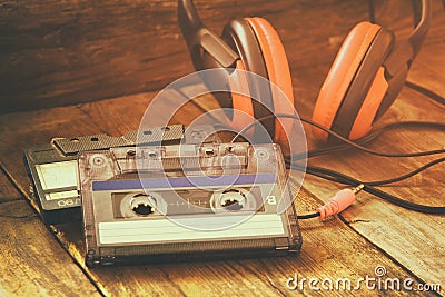 Cassette tape over wooden table. image is instagram style filtered. Stock Photo