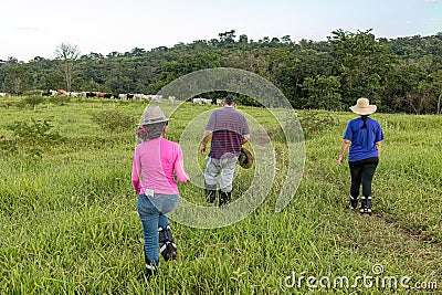 Cassilandia, Mato Grosso do Sul, Brazil - 02 28 2023: People trekking to a waterfall Editorial Stock Photo