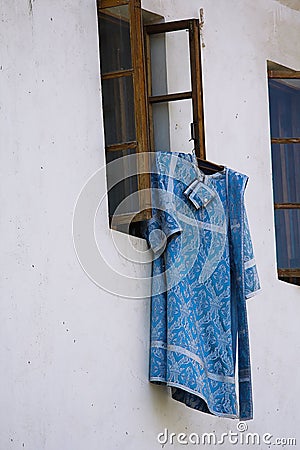 Cassock clerics posted outside Stock Photo