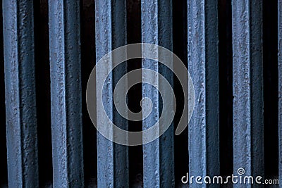 Cast-iron battery, old, painted Old cast-iron battery in blue color Stock Photo