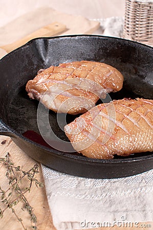 Cast iron frying pan with cooking duck Stock Photo