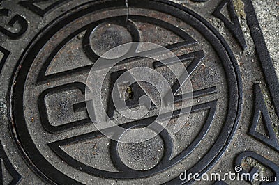 Cast iron manhole for an urban gas network in France Editorial Stock Photo