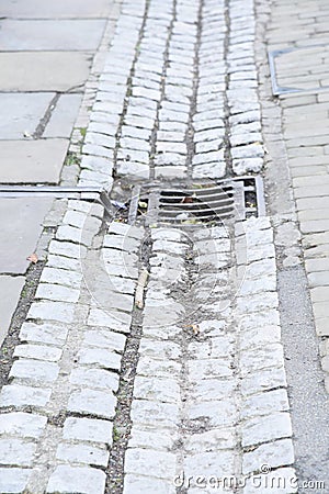 Cast iron rain stormwater drainage system a pipe and slit tray Stock Photo