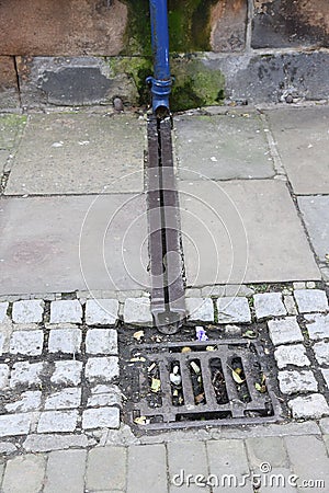 Cast iron rain stormwater drainage system a pipe and slit tray Stock Photo