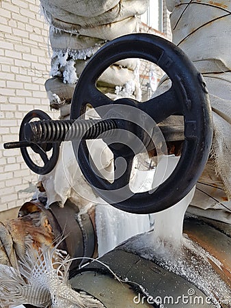 Cast iron shut-off valve on the heating main Stock Photo