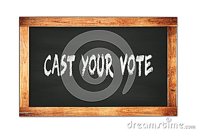 CAST YOUR VOTE text written on wooden frame school blackboard Stock Photo