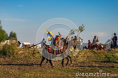 Castellan, a Hussar, riding on a horse and checking the troops, historical reenactment of Battle of Gniew Editorial Stock Photo