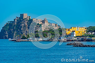 Castello Aragonese behind hotels of Italian island Ischia Editorial Stock Photo