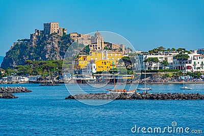 Castello Aragonese behind hotels of Italian island Ischia Editorial Stock Photo