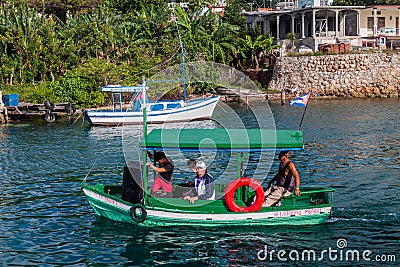 CASTILLO DE JAGUA, CUBA - FEB 12, 2016: Small wooden boat at Bahia de Jagua bay near Cienfuegos, Cu Editorial Stock Photo
