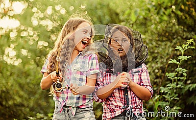 Casting off. having fun. fish angler. two girls fishing. Big game fishing. summer hobby. happy children with net and rod Stock Photo