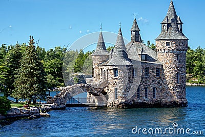 Castle with a bridge on the water near the island Stock Photo