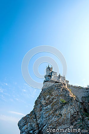 Castle on the cliff in sunny day with blue sky Stock Photo