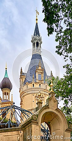 Castle garden gate with tower of Schwerin castle in the background. Mecklenburg-Vorpommern, Germany Stock Photo