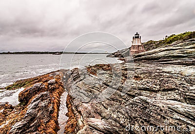 Castle Hill Lighthouse in Newport, Rhode Island, situated on a dramatic rocky coastline Stock Photo