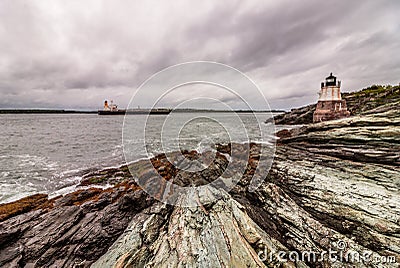 Castle Hill Lighthouse in Newport, Rhode Island, situated on a dramatic rocky coastline Stock Photo