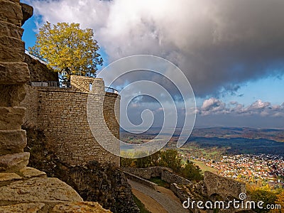 Medieval castle detail with view to town in valley Stock Photo