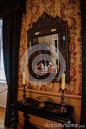 Castle interior. Antique mirror in a carved frame. Castle Duchcov, Czech Republic Editorial Stock Photo