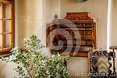 Castle interior, Baroque and renaissance furniture, bureau with swing doors, wooden secretaire en portefeuille, antique desk for Editorial Stock Photo