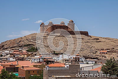 The Castillo de la Calahorra is on a hill, cerro Amesetado, 1240 m above sea level in the flanks of the mighty Sierra Nevada. Stock Photo