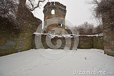 Remaining walls and tower of Bancroft Castle on top of a hills in a snow storm Stock Photo