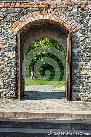 Castle wooden door leading to garden Stock Photo