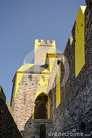 Yellow plastered castle walls of the fortress La CitÃ©, Carcassonne, France Stock Photo
