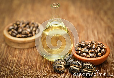 Castor beans and oil Stock Photo