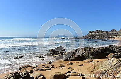 Wild beach with rocks, big waves and prehistoric settlement ruins. Sunny day, Barona, Galicia, Spain. Stock Photo