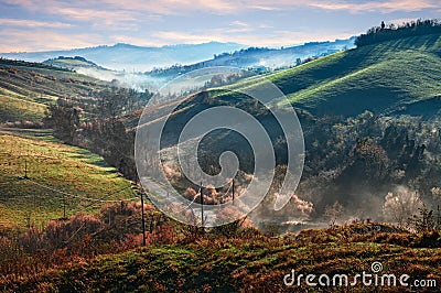 Castrocaro Terme e Terra del Sole, Forli-Cesena, Emilia Romagna, Italy: landscape at sunrise of the hills with fog in the valley Stock Photo