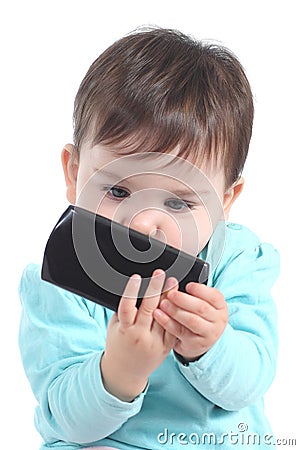 Casual baby watching attentive a mobile phone Stock Photo