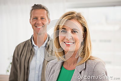 Casual business colleagues smiling at camera Stock Photo