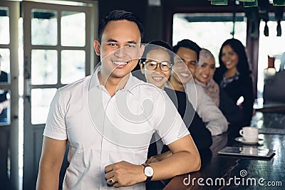 Casual businessman leader on the foreground of his team Stock Photo