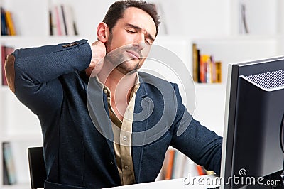 Casual Businessman With Pain In His Neck Stock Photo